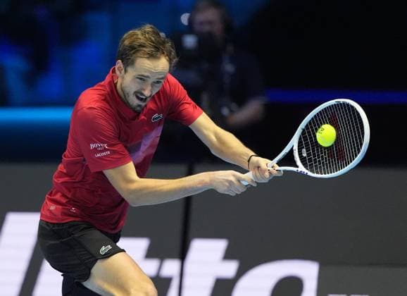(241115) -- TURIN, Nov. 15, 2024 -- Daniil Medvedev of Russia hits a return during the round robin match against Jannik Sinner of Italy at the Nitto ATP, Tennis Herren Finals in Turin, Italy, on Nov. 14, 2024. (SP)ITALY-TURIN-TENNIS-NITTO ATP FINALS-SINNER VS MEDVEDEV (Xinhua) 