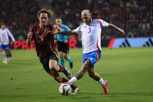 (241115) -- BRUSSELS, Nov. 15, 2024 -- Federico Dimarco (R) of Italy vies with Wout Faes of Belgium during the UEFA Nations League 2024 25 League A football match between Belgium and Italy in Brussels, Belgium, Nov. 14, 2024. ) (SP)BELGIUM-BRUSSELS-FOOTBALL-UEFA NATIONS LEAGUE A-ITALY VS BELGIUM ZhaoxDingzhe 