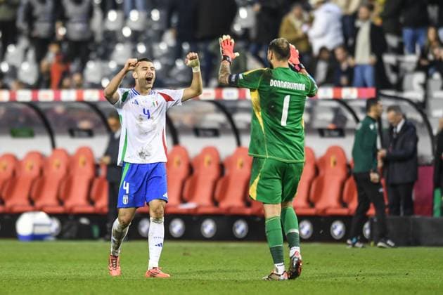 (241115) -- BRUSSELS, Nov. 15, 2024 -- Alessandro Buongiorno (L) of Italy and Gianluigi Donnarumma, goalkeeper of Italy, celebrate after the UEFA Nations League 2024 25 League A football match between Belgium and Italy in Brussels, Belgium, Nov. 14, 2024. ) (SP)BELGIUM-BRUSSELS-FOOTBALL-UEFA NATIONS LEAGUE A-ITALY VS BELGIUM PengxZiyang 