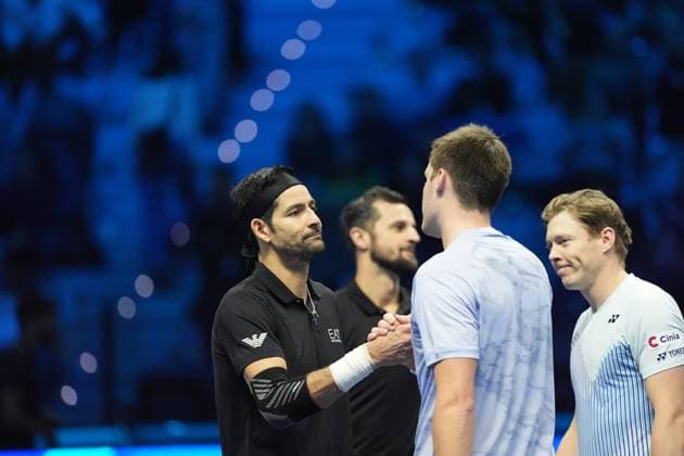 (241117) -- TURIN, Nov. 17, 2024 -- Marcelo Arevalo (1st L) of El Salvador and Mate Pavic (2nd L) of Croatia are congratulated by Henry Patten of Britain (3rd L) and Harri Heliovaara of Finland after their men s doubles semifinal match at the Nitto ATP, Tennis Herren Finals in Turin, Italy, on Nov. 16, 2024. ) (SP)ITALY-TURIN-TENNIS-NITTO ATP FINALS-SEMIFINAL-MEN S DOUBLES LixJing 