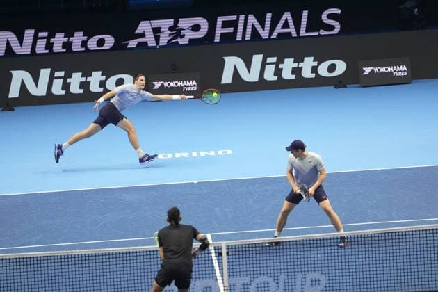 (241117) -- TURIN, Nov. 17, 2024 -- Henry Patten (L) of Britain and Harri Heliovaara of Finland compete during the men s doubles semifinal match against Marcelo Arevalo of El Salvador and Mate Pavic of Croatia at the Nitto ATP, Tennis Herren Finals in Turin, Italy, on Nov. 16, 2024. ) (SP)ITALY-TURIN-TENNIS-NITTO ATP FINALS-SEMIFINAL-MEN S DOUBLES LixJing 