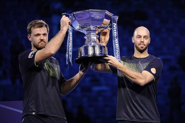 Germany s Kevin Krawietz, and Tim Puetz& xa0; celebrates with the trophy after winning the double final tennis match of the ATP, Tennis Herren World Tour Finals at the Inalpi Arena in Turin, Italy - - Sunday, November 17, 2024.  Copyright: xMarcoxAlpozzi LaPressex