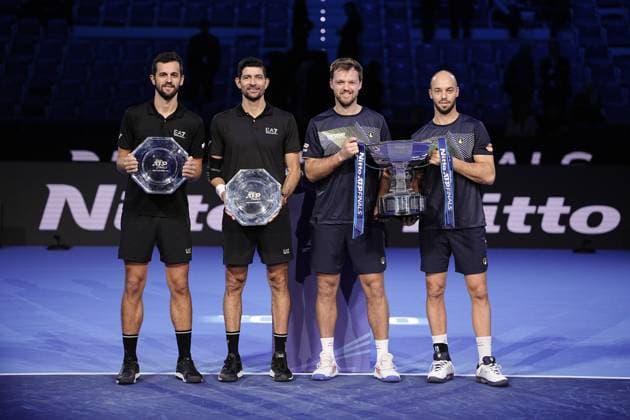 On the left Germany s Kevin Krawietz, and Tim Puetz and on the right El Salvador s Marcelo Arevalo, and Croatia s Mate Pavic with the trophy after the double final tennis match of the ATP, Tennis Herren World Tour Finals at the Inalpi Arena in Turin, Italy - - Sunday, November 17, 2024.  Copyright: xMarcoxAlpozzi LaPressex