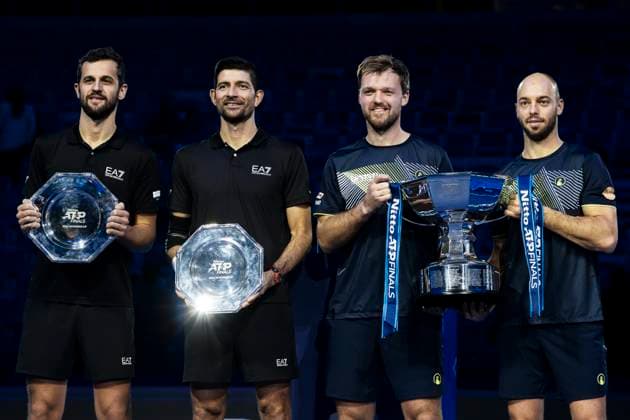 Nitto ATP, Tennis Herren Finals - Day Eight Kevin Krawietz and Tim Putz of Germany pose with the trophy next to Mate Pavic of Croatia and Marcelo Arevalo of El Salvador at the end of the final doubles match during day eight of the Nitto ATP Finals. Turin Italy Copyright: xNicolòxCampox