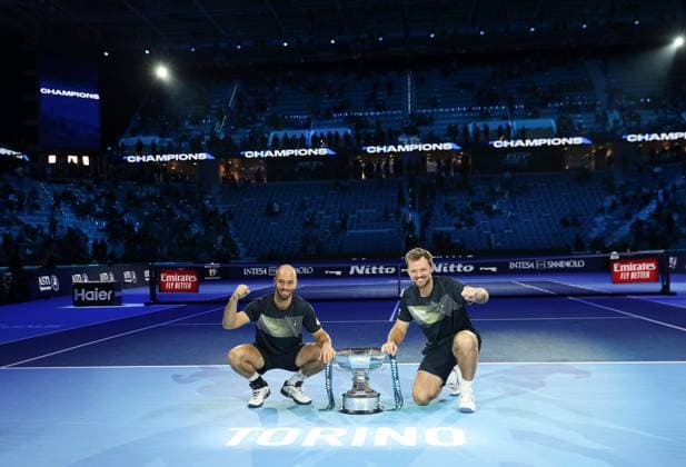 (241118) -- TURIN, Nov. 18, 2024 -- Winners Kevin Krawietz (R) Tim Puetz of Germany pose with the trophy after winning the men s doubles final match between Kevin Krawietz Tim Puetz of Germany and Marcelo Arevalo(El Salvador) Mate Pavic(Croatia) at the Nitto ATP, Tennis Herren Finals in Turin, Italy, on Nov. 17, 2024. ) (SP)ITALY-TURIN-TENNIS-ATP FINALS-MEN S DOUBLES-FINAL LixJing 