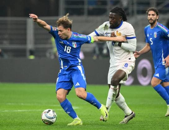 (241118) -- MILAN, Nov. 18, 2024 -- Nicolo Barella (1st L) of Italy vies for the ball against Manu Kone (2nd L) of France during the UEFA Nations League 2024 25 League A Group 2 football match between Italy and France in Milan, Italy, Nov. 17, 2024. (Photo by Alberto Lingria Xinhua) (SP)ITALY-MILAN-FOOTBALL-UEFA NATIONS LEAGUE-ITALY VS FRANCE LixJing 