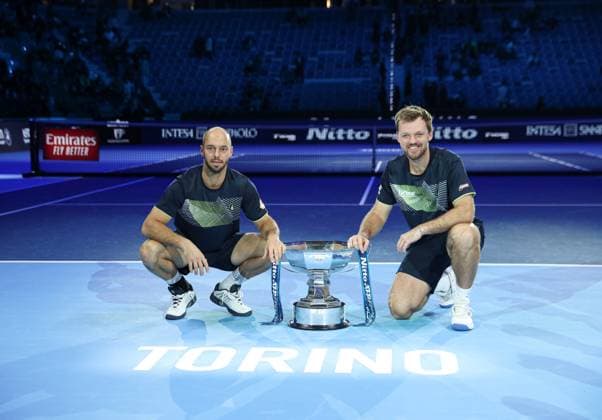 (241118) -- TURIN, Nov. 18, 2024 -- Winners Kevin Krawietz (R) Tim Puetz of Germany pose with the trophy after winning the men s doubles final match between Kevin Krawietz Tim Puetz of Germany and Marcelo Arevalo(El Salvador) Mate Pavic(Croatia) at the Nitto ATP, Tennis Herren Finals in Turin, Italy, on Nov. 17, 2024. ) (SP)ITALY-TURIN-TENNIS-ATP FINALS-MEN S DOUBLES-FINAL LixJing 