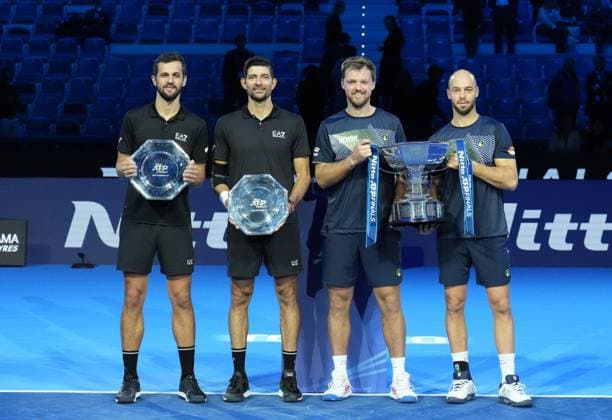 (241118) -- TURIN, Nov. 18, 2024 -- Winners Kevin Krawietz (2nd R) Tim Puetz (1st R) and runners-up Marcelo Arevalo (2nd L) Mate Pavic pose during the awarding ceremony after the men s doubles final match between Kevin Krawietz Tim Puetz of Germany and Marcelo Arevalo(El Salvador) Mate Pavic(Croatia) at the Nitto ATP, Tennis Herren Finals in Turin, Italy, on Nov. 17, 2024. ) (SP)ITALY-TURIN-TENNIS-ATP FINALS-MEN S DOUBLES-FINAL LixJing 