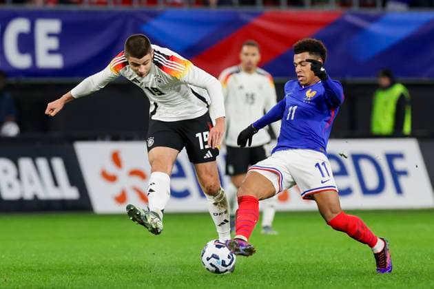 France, Valenciennes, 19 11 2024, Stade du Hainaut, France U21 v Germany U21 International Friendly, Nicolo Tresoldi Germany and Desire Doue France battle for the ball Valenciennes Stade du Hainaut France eu-images-700