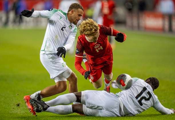 November 19, 2024, Toronto, On, CANADA: Canada forward Jacob Shaffelburg (14) is tackled hard by Suriname defenders Leo Abena (12) and Liam Van Gelderen (2) in CONCACAF Nations League action in Toronto, Tuesday, Nov. 19, 2024. Canada News - November 19, 2024  - ZUMAc35_ 20241119_zaf_c35_147 Copyright: xFrankxGunnx