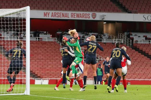 21st November 2024; Arsenal Stadium, London, England; Womens Champions League, Arsenal versus Juventus; goalkeeper Pauline Peyraud-Magnin of Juventus comes out for an incoming corner but the ball is headed away by Amalie Vangsgaard of Juventus  ActionPlus12717359 KatiexChan