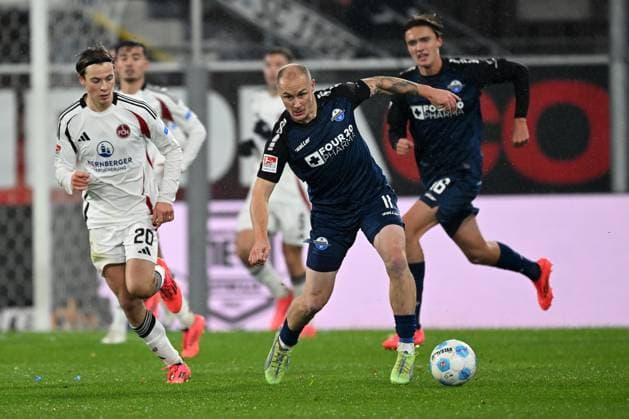 Paderborn, Home Deluxe Arena, 22 11 24, GER, Men, 2 Bundesliga, Season 2024 2025, SC Paderborn 07 1 FC Nuernberg Picture from left in duel Caspar JANDER Nuernberg and Sven MICHEL Paderborn Only for editorial use DFL regulations prohibit any use of photographs as image sequences and or quasi video NRW Germany