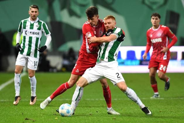 Dejan Ljubicic 1 FC Köln and Mikkel Kirkeskov Preussen Muenster battle for the ball during the 2 Bundesliga match between Preußen Münster and 1 FC Köln at Preußenstadion on November 22, 2024 in Münster, Germany Germany Photo by Ralf Treese DeFodi Images Dejan Ljubicic 1 FC Köln and Mikkel Kirkeskov Preussen Muenster battle for the ball during the 2 Bundesliga match between Preußen Münster and 1 FC Köln at Preußenstadion on November 22, 2024 in Münster, Germany Photo by Ralf Treese DeFodi Images DFB DFL REGULATIONS PROHIBIT ANY USE OF PHOTOGRAPHS AS IMAGE SEQUENCES AND OR QUASI VIDEO Defodi 521 SCPKOE20241122 022 Defodi-521 not used in POL SRB CRO FRA GBR NED ITA USA DFB DFL REGULATIONS PROHIBIT ANY USE OF PHOTOGRAPHS AS IMAGE SEQUENCES AND OR QUASI-VIDEO.
