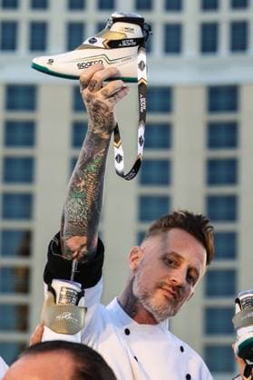 Formula 1 2024: F1 Las Vegas Grand Prix - Bellagio Fountain Club NOV 22 November 22, 2024: Chef Michael Voltaggio holds a Shoey during the Bellagio Fountain Club open house during the F1 Las Vegas Grand Prix Fan Experience in Las Vegas, NV. Christopher Trim CSM. (Credit Image: Â Christopher Trim Cal Media) Las Vegas Nevada United States of America EDITORIAL USE ONLY Copyright: xx ZUMA-20241122_zma_c04_110.jpg ChristopherxTrimx csmphotothree323312