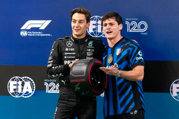 British Formula One driver George Russell of Mercedes-AMG Petronas and Italian soccer player Gianluca Conte pose with the pole award following qualifying for the Formula One Las Vegas Grand Prix at the Las Vegas Strip Circuit in Las Vegas on Friday, November 22, 2024.  LAV2024112279 GREGxNASH