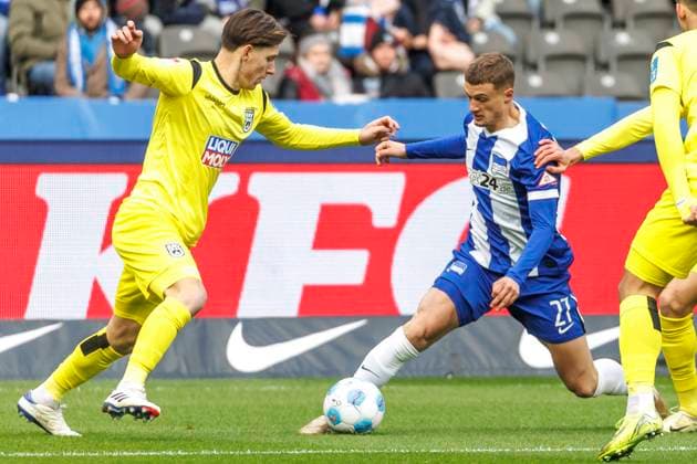 Berlin, 23 11 24, Soccer, 2 Bundesliga, Matchday 13, Hertha BSC SSV Ulm 1846, Olympiastadion Max Brandt of SSV Ulm fights for the ball against Berlins Mickal Cuisance DFL regulations and DFB regulations prohibit any use of photographs as image sequences and or quasi video, Foto Andreas Gora Hertha BSC SSV Ulm 1846