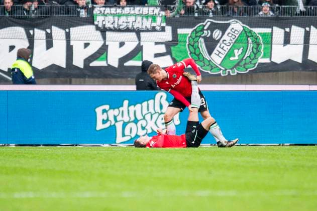 23 11 2024 Football, 2024 2025, 2 Bundesliga, Matchday 13, Hannover 96 SV Darmstadt 98 L R Phil Neumann Hannover , Marcel Halstenberg Hannover injured, Injury DFL REGULATIONS PROHIBIT ANY USE OF PHOTOGRAPHS AS IMAGE SEQUENCES AND OR QUASI VIDEO Hannover Lower Saxony Germany Heinz von Heiden Arena