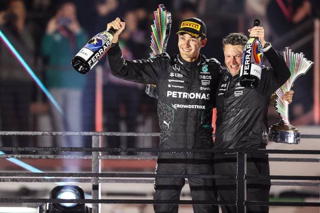 Formula 1 2024: Formula 1 Las Vegas Grand Prix NOV 23. November 23, 2024: Mercedes-AMG Petronas F1 Team driver George Russell (63) raises a bottle of champagne and the championship trophy after finishing in first place during the Formula One Heineken Silver Las Vegas Grand Prix 2024 on the Las Vegas Street Circuit in Las Vegas, NV. Christopher Trim CSM. (Credit Image: Â Christopher Trim Cal Media) Las Vegas Nevada United States of America EDITORIAL USE ONLY Copyright: xx ZUMA-20241123_zma_c04_873.jpg ChristopherxTrimx csmphotothree324823