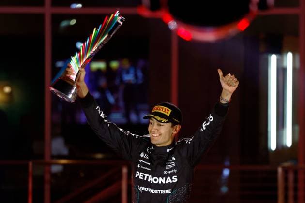 LAS VEGAS, NV - NOVEMBER 23: George Russell (63) of Great Britain, Mercedes-AMG PETRONAS F1, Team Mercedes celebrates with the trophy after winning the Formula 1 Heineken Silver Las Vegas Grand Prix on the Las Vegas Strip Circuit on November 23, 2024 in Las Vegas, Nevada. (Photo by Jeff Speer Icon Sportswire) AUTO: NOV 23 F1 Heineken Silver Las Vegas Grand Prix EDITORIAL USE ONLY Icon2411231671