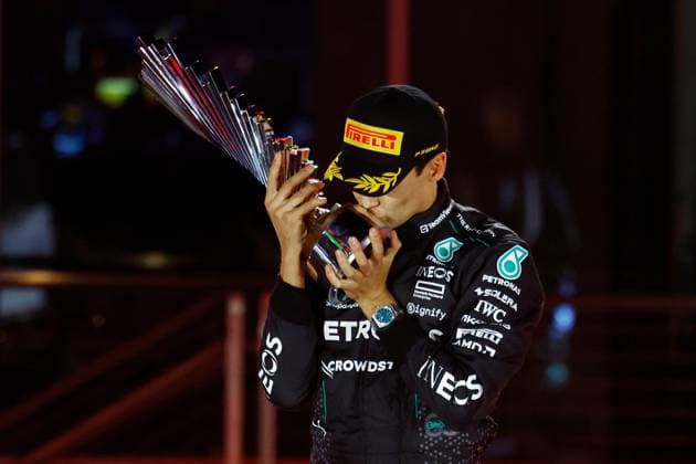 LAS VEGAS, NV - NOVEMBER 23: George Russell (63) of Great Britain, Mercedes-AMG PETRONAS F1, Team Mercedes celebrates kisses the trophy after winning the Formula 1 Heineken Silver Las Vegas Grand Prix on the Las Vegas Strip Circuit on November 23, 2024 in Las Vegas, Nevada. (Photo by Jeff Speer Icon Sportswire) AUTO: NOV 23 F1 Heineken Silver Las Vegas Grand Prix EDITORIAL USE ONLY Icon2411231691