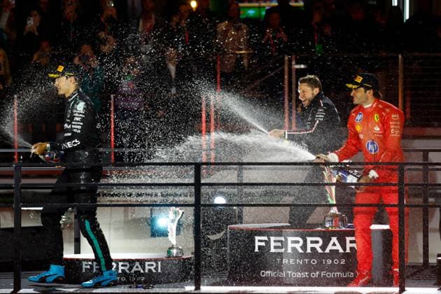 LAS VEGAS, NV - NOVEMBER 23: George Russell (63, left) of Great Britain, Mercedes-AMG PETRONAS F1, Team Mercedes is sprayed with champagne by Carlos Sainz (55, right, 3rd place) of Spain, Scuderia Ferrari and winning constructor Mercedes AMG principal track engineer Richard Lane at the completion of the Formula 1 Heineken Silver Las Vegas Grand Prix on the Las Vegas Strip Circuit on November 23, 2024 in Las Vegas, Nevada. (Photo by Jeff Speer Icon Sportswire) AUTO: NOV 23 F1 Heineken Silver Las Vegas Grand Prix EDITORIAL USE ONLY Icon2411231871