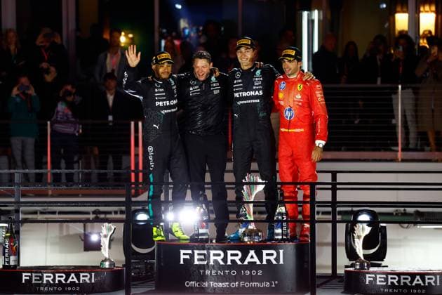 LAS VEGAS, NV - NOVEMBER 23: Lewis Hamilton (44, left) of Great Britain, Mercedes-AMG PETRONAS F1, Team Mercedes, winning constructor Mercedes AMG principal track engineer Richard Lane (center left), race winner George Russell (63, center right) of Great Britain, Mercedes-AMG PETRONAS F1, Team Mercedes, and Carlos Sainz (55, right) of Spain, Scuderia Ferrari pose for photos at the completion of the Formula 1 Heineken Silver Las Vegas Grand Prix on the Las Vegas Strip Circuit on November 23, 2024 in Las Vegas, Nevada. (Photo by Jeff Speer Icon Sportswire) AUTO: NOV 23 F1 Heineken Silver Las Vegas Grand Prix EDITORIAL USE ONLY Icon2411231931