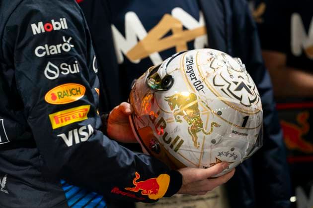 Dutch Formula One driver Max Verstappen of Red Bull Racing holds a helmet from advisor Helmut Marko for winning his fourth drivers World Championship, WM, Weltmeisterschaft following the Formula One Las Vegas Grand Prix at the Las Vegas Strip Circuit in Las Vegas on Sunday, November 24, 2024.  LAV2024112406 GREGxNASH