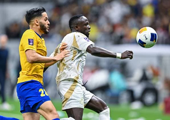 AFC CHAMPIONS LEAGUE ELITE, AL GHARAFA SC (QTR) v AL NASSR FC (KSA) Sadio Mane (R) of Al Nassr FC and Wajdi Kechrida of Al Gharafa SC in action during the AFC Champions League elite west football match between Qatar s Al Gharafa SC and Saudi Arabia s Al Nassr FC at Al-Bayt Stadium in Al Khor, Qatar, on November 25, 2024 DOHA Qatar Copyright: xNAUSHADx