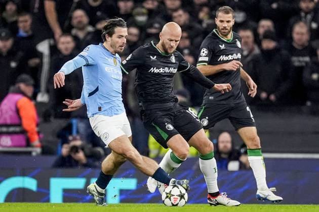 UEFA Champions League: Manchester City F.C. v Feyenoord Manchester - Jack Grealish of Manchester City FC, Gernot Trauner of Feyenoord, Bart Nieuwkoop of Feyenoord during the fifth round of new format of the UEFA Champions League 2024 2025. The match is set between Manchester City and Feyenoord at Etihad Stadium on 26 November 2024 in Manchester, England. Copyright: xTomxBodex