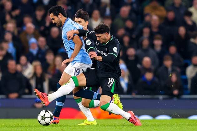 Manchester City FC v Feyenoord Julian Carranza of Feyenoord slides in to tackle Ilkay Gundogan of Manchester City during the Manchester City FC v Feyenoord UEFA Champions League Round 1 league stage match at the Etihad Stadium, Manchester, England, United Kingdom on 26 November 2024 Editorial use only. All images are copyright Every Second Media Limited. No images may be reproduced without prior permission. Copyright: xIMAGO EveryxSecondxMediax ESM-1226-0036