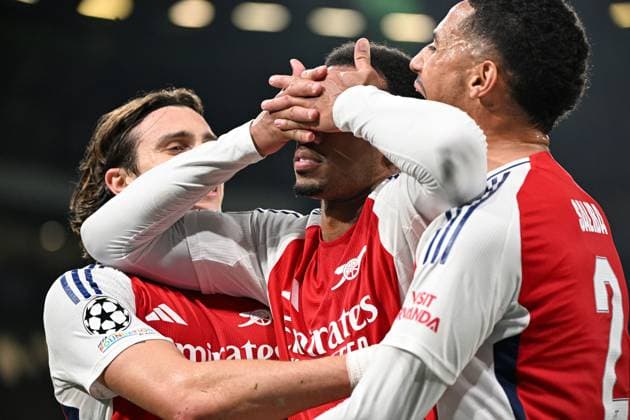 Gabriel Magalhaes of Arsenal celebrates scoring the goal for their side with their teammates to make it 3-0 Sporting Lisbon v Arsenal, UEFA Champions League, Group Stage, Football, Estadio Jose Alvalade, Lisbon, Portugal - 26 Nov 2024 EDITORIAL USE ONLY No use with unauthorised audio, video, data, fixture lists, club league logos or live services. Online in-match use limited to 120 images, no video emulation. No use in betting, games or single club league player publications. Copyright: xZedxJameson Shutterstockx 14940177cq
