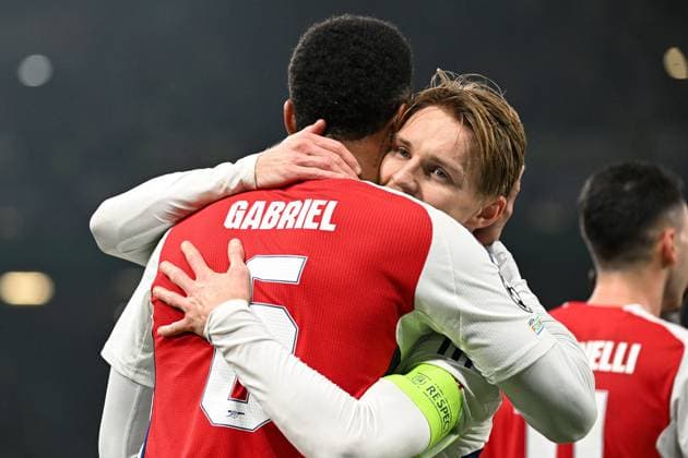 Gabriel Magalhaes of Arsenal celebrates scoring a goal for their side to make it 3-0 with Martin odegaard of Arsenal Sporting Lisbon v Arsenal, UEFA Champions League, Group Stage, Football, Estadio Jose Alvalade, Lisbon, Portugal - 26 Nov 2024 EDITORIAL USE ONLY No use with unauthorised audio, video, data, fixture lists, club league logos or live services. Online in-match use limited to 120 images, no video emulation. No use in betting, games or single club league player publications. Copyright: xZedxJameson Shutterstockx 14940177cw