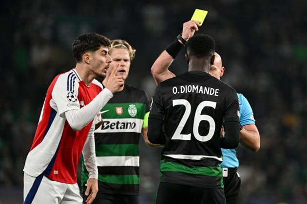 Ousmane Diomande of Sporting CP receives an early yellow card from Referee Szymon Marciniak Sporting Lisbon v Arsenal, UEFA Champions League, Group Stage, Football, Estadio Jose Alvalade, Lisbon, Portugal - 26 Nov 2024 EDITORIAL USE ONLY No use with unauthorised audio, video, data, fixture lists, club league logos or live services. Online in-match use limited to 120 images, no video emulation. No use in betting, games or single club league player publications.  Copyright: xZedxJameson Shutterstockx 14940177cz