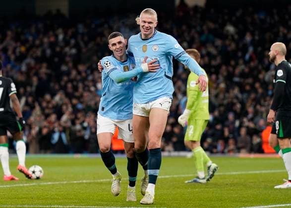 Manchester, England, 26th November 2024. Erling Haaland (R) of Manchester City celebrates after scoring to make it 3-0 during the UEFA Champions League match at the Etihad Stadium, Manchester. Picture credit should read: Andrew Yates Sportimage EDITORIAL USE ONLY. No use with unauthorised audio, video, data, fixture lists, club league logos or live services. Online in-match use limited to 120 images, no video emulation. No use in betting, games or single club league player publications. SPI-3484-0040