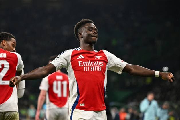 Bukayo Saka of Arsenal celebrates scoring the goal for their side with their teammates to make it 4-1 Sporting Lisbon v Arsenal, UEFA Champions League, Group Stage, Football, Estadio Jose Alvalade, Lisbon, Portugal - 26 Nov 2024 EDITORIAL USE ONLY No use with unauthorised audio, video, data, fixture lists, club league logos or live services. Online in-match use limited to 120 images, no video emulation. No use in betting, games or single club league player publications. Copyright: xZedxJameson Shutterstockx 14940177dy