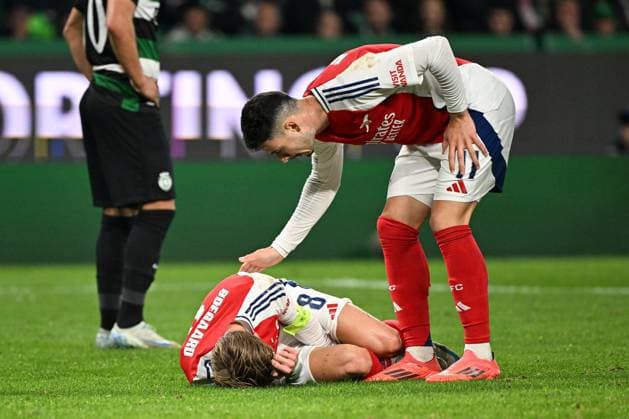Martin odegaard of Arsenal reacts on the ground after winning a penalty for their side Sporting Lisbon v Arsenal, UEFA Champions League, Group Stage, Football, Estadio Jose Alvalade, Lisbon, Portugal - 26 Nov 2024 EDITORIAL USE ONLY No use with unauthorised audio, video, data, fixture lists, club league logos or live services. Online in-match use limited to 120 images, no video emulation. No use in betting, games or single club league player publications. Copyright: xZedxJameson Shutterstockx 14940177ge