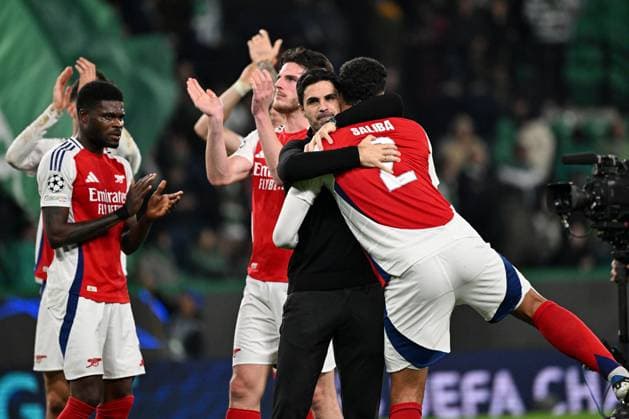 Arsenal head coach Mikel Arteta and William Saliba of Arsenal celebrate at full-time Sporting Lisbon v Arsenal, UEFA Champions League, Group Stage, Football, Estadio Jose Alvalade, Lisbon, Portugal - 26 Nov 2024 EDITORIAL USE ONLY No use with unauthorised audio, video, data, fixture lists, club league logos or live services. Online in-match use limited to 120 images, no video emulation. No use in betting, games or single club league player publications. Copyright: xZedxJameson Shutterstockx 14940177gb