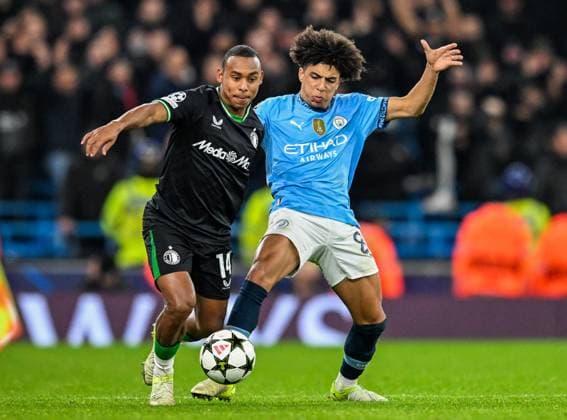 Manchester City v Feyenoord Rotterdam UEFA Champions League Igor Paixao of Feyenoord Rotterdam and Rico Lewis of Manchester City during the UEFA Champions League match at the Etihad Stadium, Manchester UK Newspapers OUT Copyright: xKarlxVallantinex FIL-20996-0092