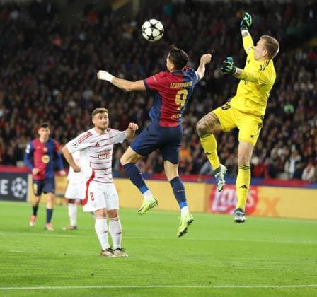 November 26, 2024, Sabadell, Barcelona, Spain: Barcelona Spain 26.11.2024 Robert Lewandowski FC Barcelona, Barca and Marco Bizot (Stade Brestois) battle for the ball during the UEFA Champions League between FC Barcelona and Stade Brestois at Estadi Olimpic Lluis Companys on 26 November 2024 in Barcelona. Sabadell Spain - ZUMAu50_ 20241126_zsp_u50_018 Copyright: xXavixUrgelesx