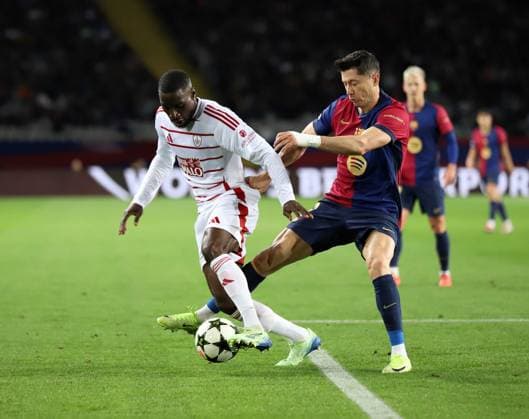 November 26, 2024, Sabadell, Barcelona, Spain: Barcelona Spain 26.11.2024 Robert Lewandowski FC Barcelona, Barca and Massadio Haidara (Stade Brestois) battle for the ball during the UEFA Champions League between FC Barcelona and Stade Brestois at Estadi Olimpic Lluis Companys on 26 November 2024 in Barcelona. Sabadell Spain - ZUMAu50_ 20241126_zsp_u50_066 Copyright: xXavixUrgelesx