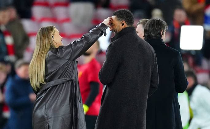 Laura Woods wipes something off the face of Rio Ferdinand Liverpool v Real Madrid, UEFA Champions League, Group Stage, Football, Anfield, Liverpool, UK - 27 Nov 2024 EDITORIAL USE ONLY No use with unauthorised audio, video, data, fixture lists, club league logos or live services. Online in-match use limited to 120 images, no video emulation. No use in betting, games or single club league player publications. Copyright: xJavierxGarcia Shutterstockx 14945029y