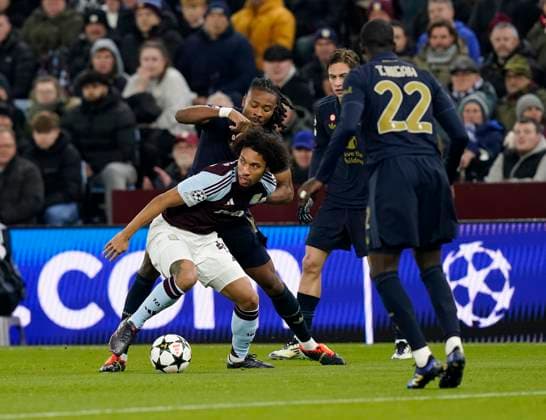 Birmingham, England, 27th November 2024. Aston Villa s Boubacar Kamara with Juventus Kenan Yildiz during the UEFA Champions League match at Villa Park, Birmingham. Picture credit should read: Andrew Yates Sportimage EDITORIAL USE ONLY. No use with unauthorised audio, video, data, fixture lists, club league logos or live services. Online in-match use limited to 120 images, no video emulation. No use in betting, games or single club league player publications. SPI-3485-0014