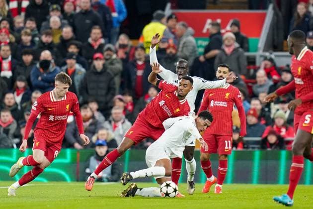 Liverpool FC v Real Madrid CF Real Madrid midfielder Jude Bellingham (5) battles with and tackled by Liverpool midfielder Ryan Gravenberch (38) during the Liverpool FC v Real Madrid CF UEFA Champions League Round 1 league phase Matchday 5 at Anfield, Liverpool, England, United Kingdom on 27 November 2024 Editorial use only. All images are copyright Every Second Media Limited. No images may be reproduced without prior permission. Copyright: xIMAGO EveryxSecondxMediax ESM-1227-0041