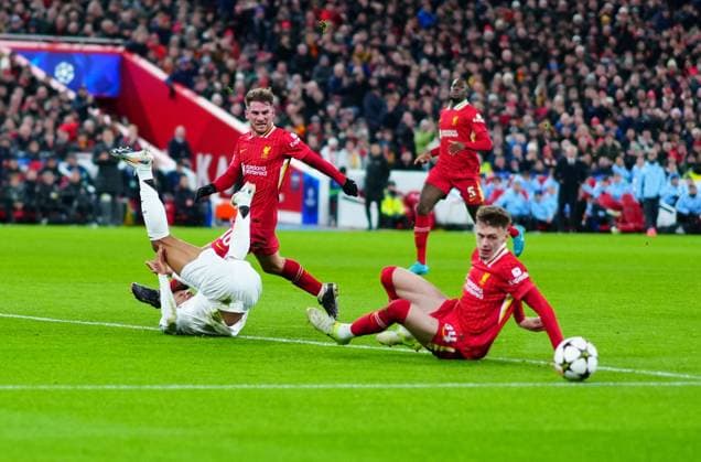 Conor Bradley of Liverpool times a superb tackle to deny Kylian Mbappà of Real Madrid Liverpool v Real Madrid, UEFA Champions League, Group Stage, Football, Anfield, Liverpool, UK - 27 Nov 2024 EDITORIAL USE ONLY No use with unauthorised audio, video, data, fixture lists, club league logos or live services. Online in-match use limited to 120 images, no video emulation. No use in betting, games or single club league player publications. Copyright: xJavierxGarcia Shutterstockx 14945029ai
