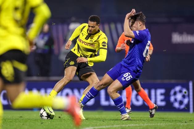 GNK Dinamo v Borussia Dortmund - UEFA Champions League 2024 25 League Phase MD5 Felix Nmecha of Borussia Dortmund competes for the ball with Branko Pavic of Dinamo Zagreb during the UEFA Champions League 2024 25 League Phase MD5 match between GNK Dinamo Zagreb and Borussia Dortmund at Maksimir stadium on November 27, 2024 in Zagreb, Croatia.  LukaxStanzl PIXSELL
