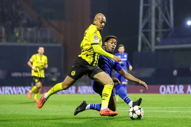 GNK Dinamo v Borussia Dortmund - UEFA Champions League 2024 25 League Phase MD5 Donyell Malen of Borussia Dortmund competes for the ball with Ronael Pierre-Gabriel of Dinamo Zagreb during the UEFA Champions League 2024 25 League Phase MD5 match between GNK Dinamo Zagreb and Borussia Dortmund at Maksimir stadium on November 27, 2024 in Zagreb, Croatia.  LukaxStanzl PIXSELL