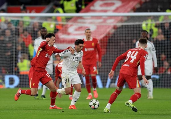 27th November 2024; Anfield, Liverpool, Merseyside, England; Champions League Football, Liverpool versus Real Madrid; Brahim Diaz of Real Madrid takes on Curtis Jones and Alexis MacAllister of Liverpool  ActionPlus12720634 DavidxBlunsden