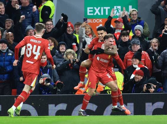 Liverpool, England, 27th November 2024. Liverpool™s Alexis Mac Allister celebrates scoring his sides opening goal during the UEFA Champions League match at Anfield, Liverpool. Picture credit should read: Jessica Hornby Sportimage EDITORIAL USE ONLY. No use with unauthorised audio, video, data, fixture lists, club league logos or live services. Online in-match use limited to 120 images, no video emulation. No use in betting, games or single club league player publications. SPI-3486-0073