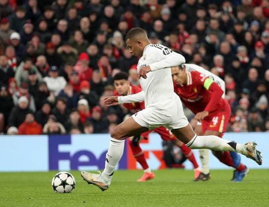Liverpool, England, 27th November 2024. Real Madrid s Kylian Mbappe misses his penalty during the UEFA Champions League match at Anfield, Liverpool. Picture credit should read: Jessica Hornby Sportimage EDITORIAL USE ONLY. No use with unauthorised audio, video, data, fixture lists, club league logos or live services. Online in-match use limited to 120 images, no video emulation. No use in betting, games or single club league player publications. SPI-3486-0075