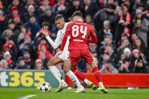 Kylian Mbappe Real Madrid CF and Conor Bradley Liverpool FC battle for the ball during the UEFA Champions League 2024 25 League Phase MD5 match between Liverpool FC and Real Madrid C F at Anfield on November 27, 2024 in Liverpool, England Defodi 541 LIVREA20241127 038 Defodi-541